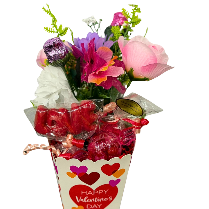 Assorted Valentine’s chocolate gift box with plush toy and decorative packaging
