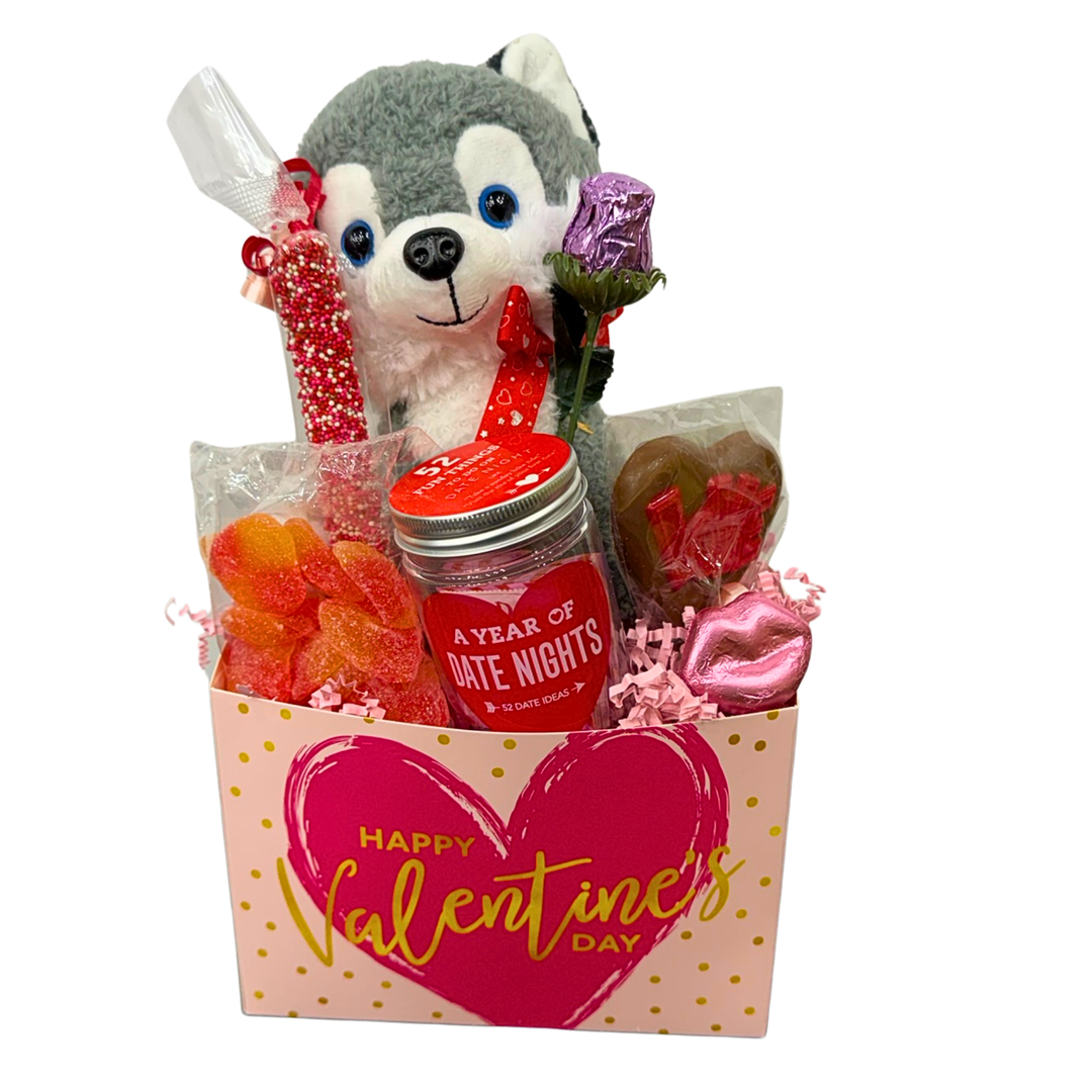 Holiday Valentine’s assortment box with chocolates, candy, and stuffed animal
