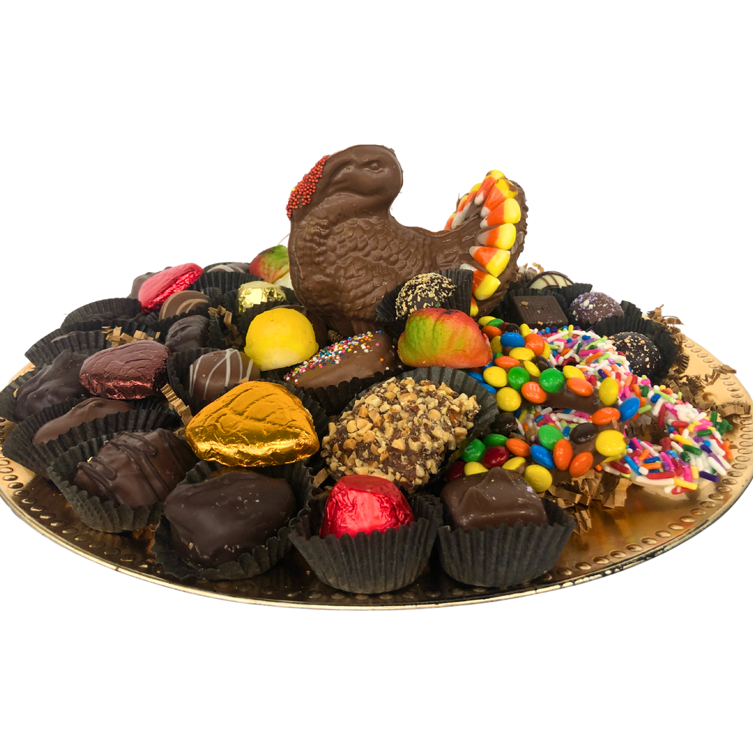 Dark/pareve chocolate turkey platter with gourmet chocolates, elegant centerpiece for holiday table.