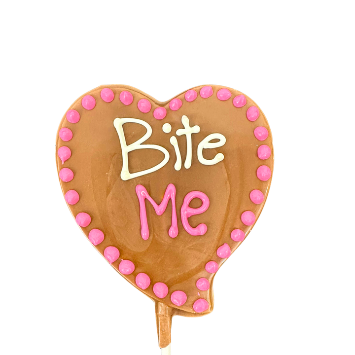 Valentine chocolate heart pops with cute love sayings in pink icing