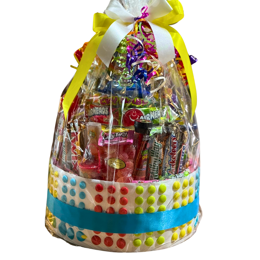 Large candy cake stacked with assorted sweets arranged in tiers