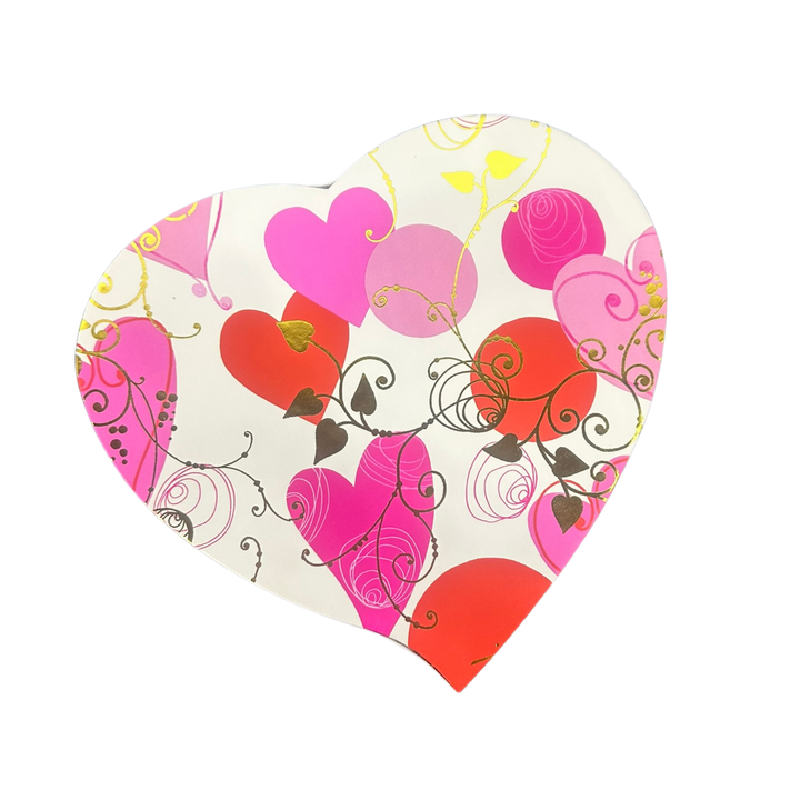 Valentine’s heart box of assorted chocolates in red and pink packaging
