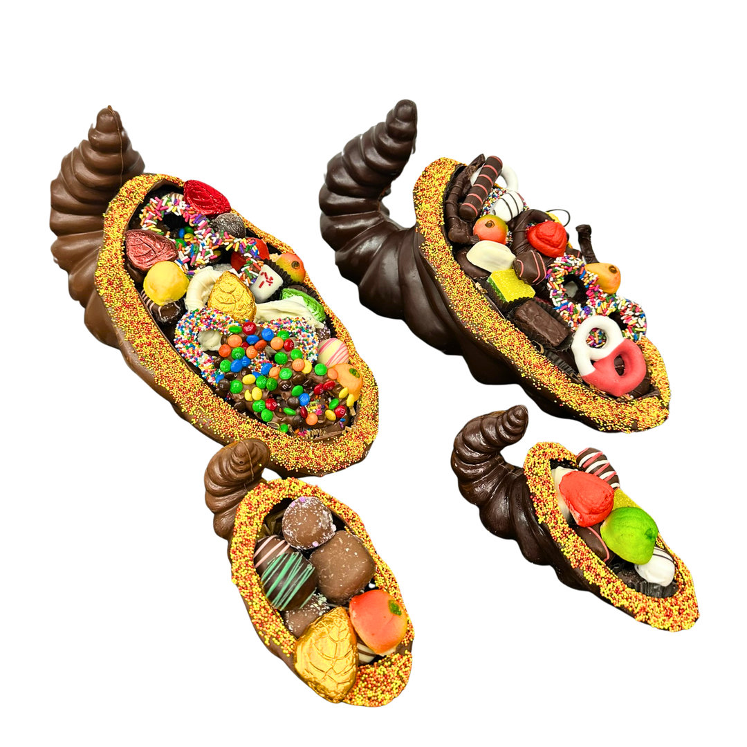 Decorative chocolate horns filled with various chocolate