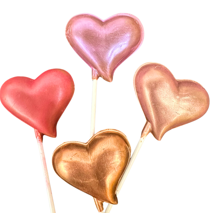 Handcrafted chocolate lollipops with Valentine’s hearts and lips designs
