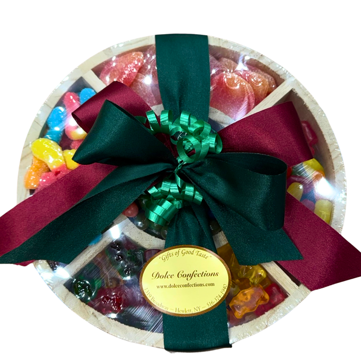 Round candy board with bright gummy candies and marshmallow twists.