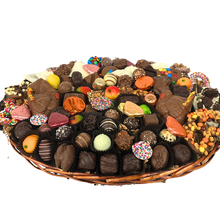 Large kosher chocolate gift basket overflowing with milk and dark chocolates, perfect for holiday gifting