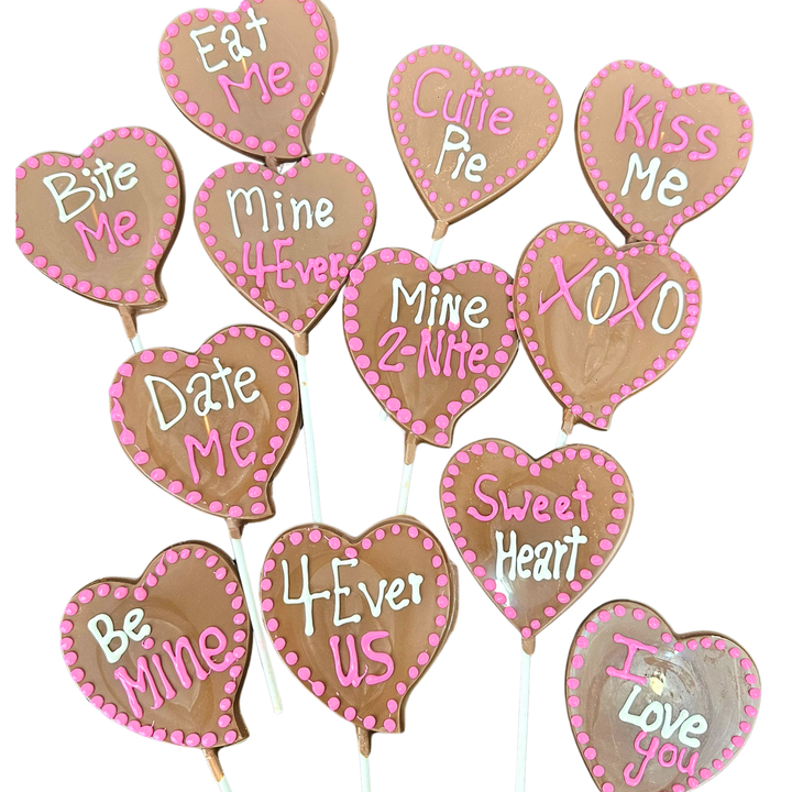 Valentine heart chocolate message pops with handwritten phrases on sticks